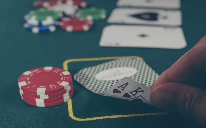 close up photo of poker chips and cards