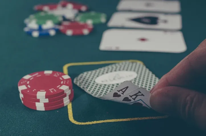 close up photo of poker chips and cards