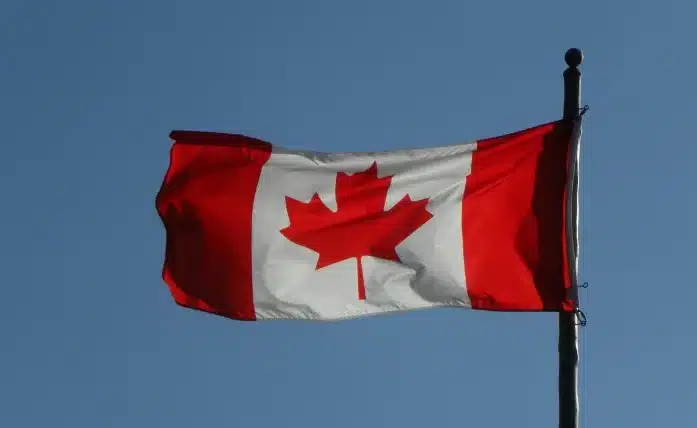 Canadian Flag in blue skies